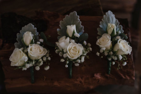 Mini rose and baby's breath buttonholes