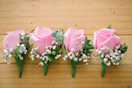 Pink rose and baby's breath buttonholes